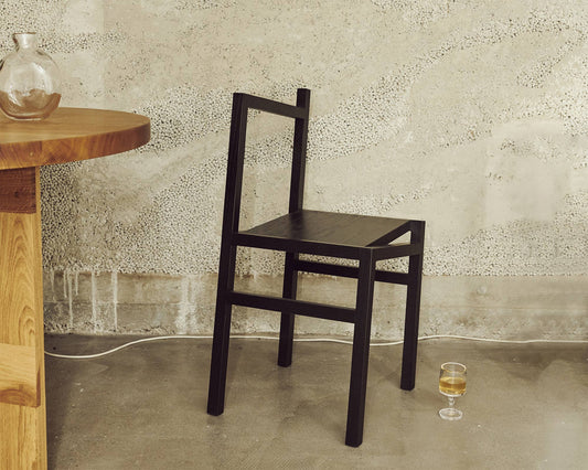 FRAMA 9.5° Asymmetric Chair in Black Ash